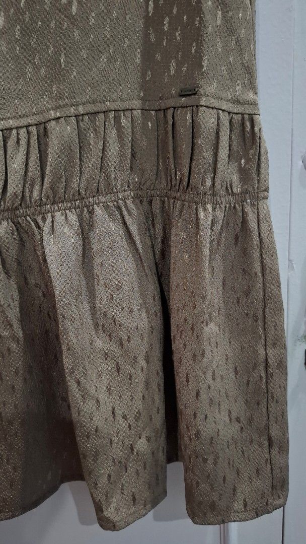 Brown Textured Slip Dress with Ruffle Hem (Category: Dresses) located in Quezon City. Submitted by croppedph (Listing ID 1462882019, Image 2). Description: - Elegant brown slip dress - Textured fabric with a subtle sheen - Delicate spaghetti straps - Flirty ruffled tier at the hem - Ideal for layering or wearing solo - Easily dressed up or down for any occasion.