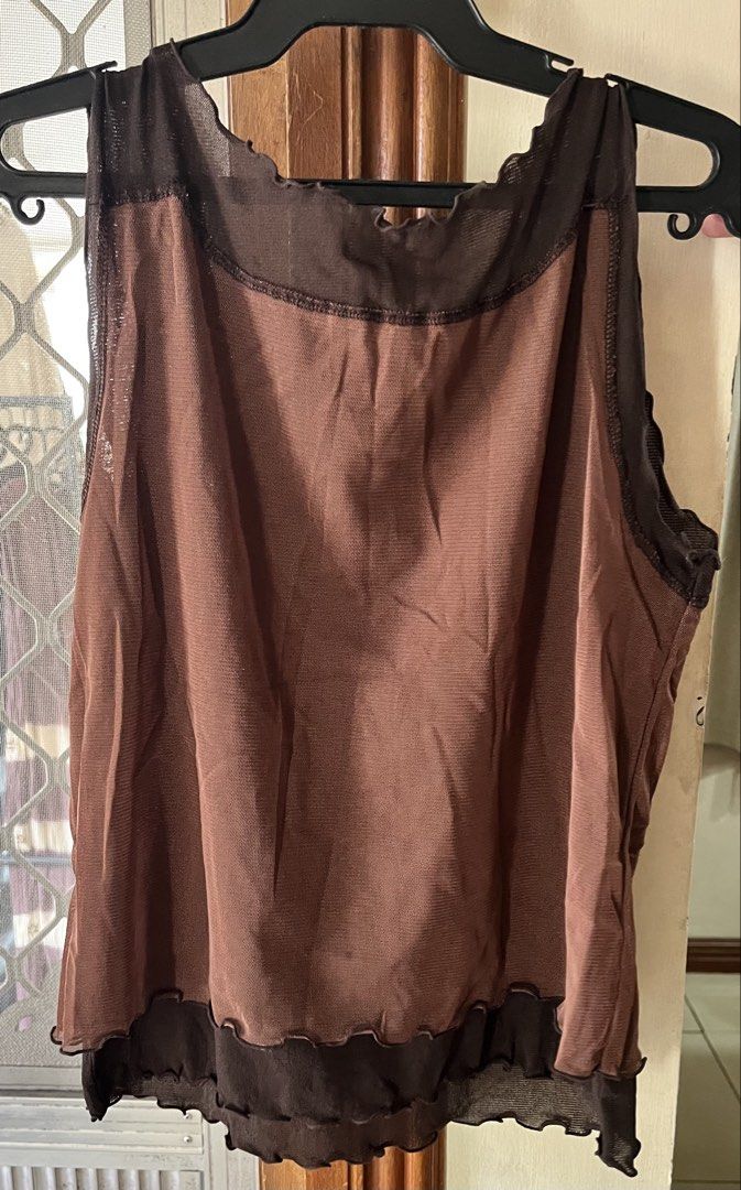 Brown top (Category: Blouses) located in Bacoor. Submitted by ayit. (Listing ID 1462717985, Image 2). Description: - Brown top from Japn brand - Size: Small (S/36/8/4) - Layered design with sheer mesh accents - Features delicate ruffled edges on neckline and hem - Perfect for casual wear.