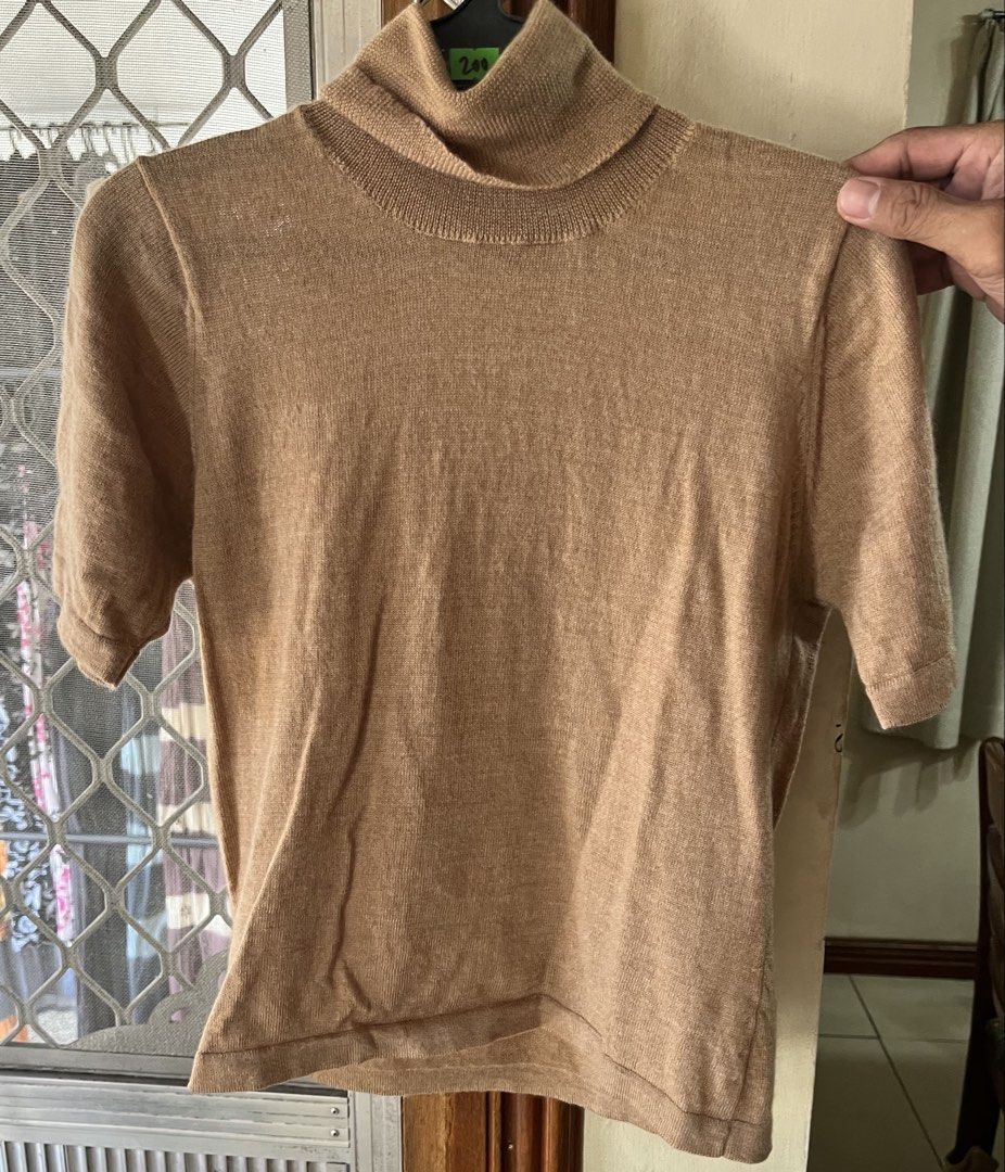 Brown top (Category: Blouses) located in Bacoor. Submitted by ayit. (Listing ID 1462718551, Image 1). Description: - Brown turtleneck top - Size: S - Soft fabric - Versatile for layering - Available for meetup in Bacoor, Cavite.