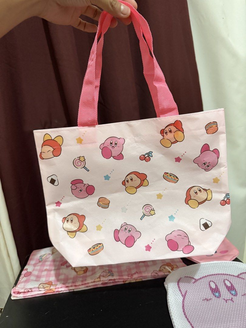 Bundle Cute Kirby Tote Bag, Laundry Pouch, Drawstring Bags & Pouch (Category: Purses & Pouches) located in Caloocan City. Submitted by rohllee (Listing ID 1462723179, Image 2). Description: - Adorable Kirby themed bag set! - Includes: 1 Tote Bag, 1 Zippered Mesh Laundry Pouch, 2 Drawstring Pouches - One drawstring pouch features a cute checkered pattern. - Perfect for organizing your essentials or as a delightful gift for any Kirby enthusiast. - 