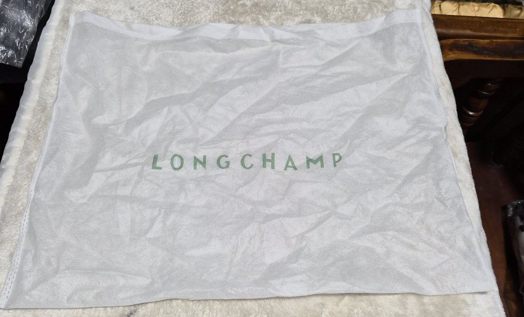Bundle dust bag - Prada, Longchamp, Moins De Dust Bags (Category: Baby Monitors) located in Mandaue City. Submitted by chuchi152615 (Listing ID 1462742738, Image 3). Description: - Bundle includes: 1 Prada dust bag, 1 Longchamp dust bag, 1 Moins Studio Design dust bag. - Ideal for protecting your handbags and other accessories. - Keeps your items safe and dust-free. - Measurements available in photos. - Great for storage needs..