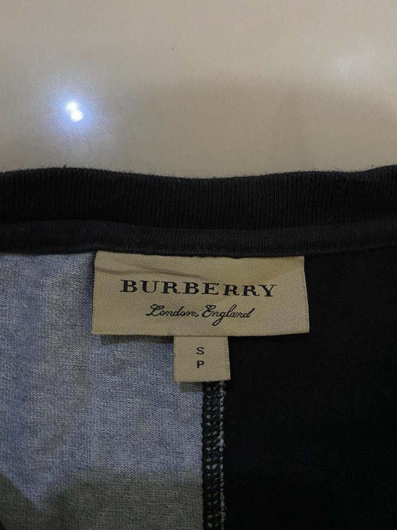 Burberry T shirt (Category: Coats, Jackets and Outerwear) located in Nagcarlan. Submitted by livehorse.542a4e (Listing ID 1462736370, Image 3). Description: excellent condition cr:10/10 dimes:27X20 no issue.
