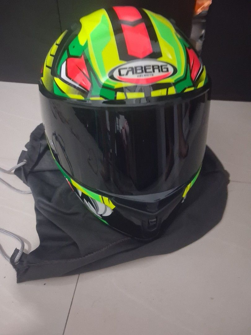 CABERG DCAB-00080 Avalon Giga Helmet (Category: Helmets and other Riding Gears) located in Santa Rosa. Submitted by missleopardyshop (Listing ID 1462776114, Image 1). Description: - Caberg Avalon Giga Helmet (Model: DCAB-00080) - Eye-catching design: Bright green, red, and yellow - Includes a dark visor for sun protection - Comes with a protective helmet bag - Ideal for a safe and stylish ride Caberg brand (cannot type the brand above not in the 