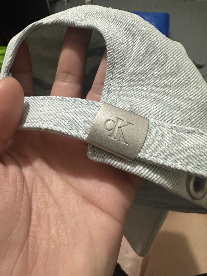 Calvin Klein CK Denim Cap (Category: Caps & Hats) located in Manila. Submitted by aoparaiso (Listing ID 1461482669, Image 3). Description: - Brand: Calvin Klein - Style: Denim Cap - Color: Light Wash - Feature: Embroidered CK logo on front - Fit: Adjustable strap at the back - Occasion: Everyday wear.