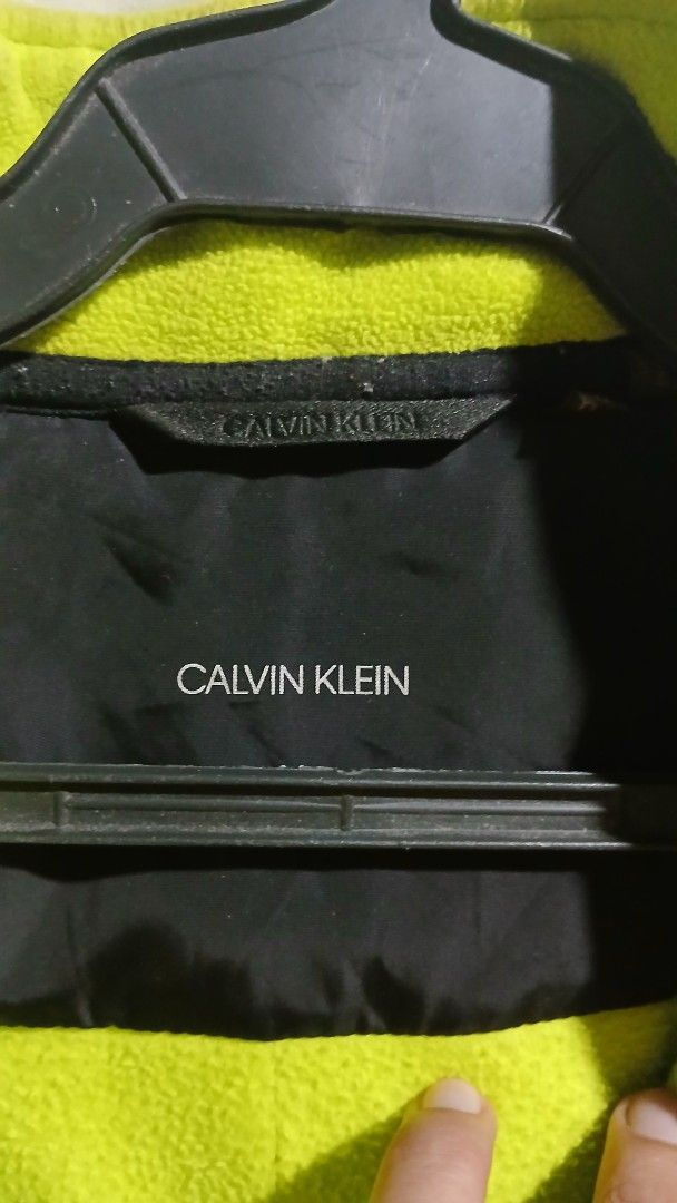 Calvin Klein Colorblock Fleece Jacket (Category: Coats, Jackets and Outerwear) located in Caloocan City. Submitted by vincefresn21903 (Listing ID 1462681835, Image 3). Description: - Cool Calvin Klein jacket - Black and bright green colorblock design - Full zip front - Zippered pockets - Soft fleece material inside - Great for layering or wearing on its own - Good for casual wear or outdoor activities.
