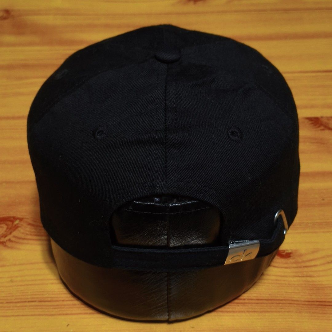 Calvin Klein Jeans Black CK Embroidered Baseball Cap (Category: Caps & Hats) located in Manila. Submitted by caps08 (Listing ID 1462875583, Image 3). Description: - Classic black Calvin Klein Jeans cap - Features the iconic CK logo embroidered on the front - Adjustable strap at the back with a metal buckle for a custom fit - Simple and versatile design, perfect for everyday wear.