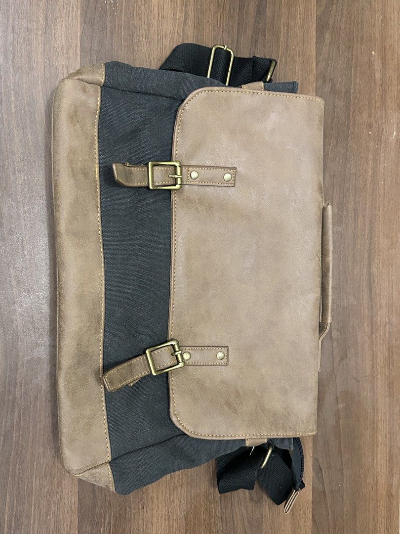Canvas & Faux Leather Messenger Bag (Category: Sling Bags) located in Manila. Submitted by itsaladean (Listing ID 1462870322, Image 1). Description: Salvatore Mann Barely used. Good as new, the design is kinda vintage. It is not old Leather and Denim Bought it for 1,299 Selling it for 450 RFS: Decluttering - Main zippered compartment for secure storage. - Internal zip pocket for organizing smaller items. - Adjustable strap for a comfortable, cust