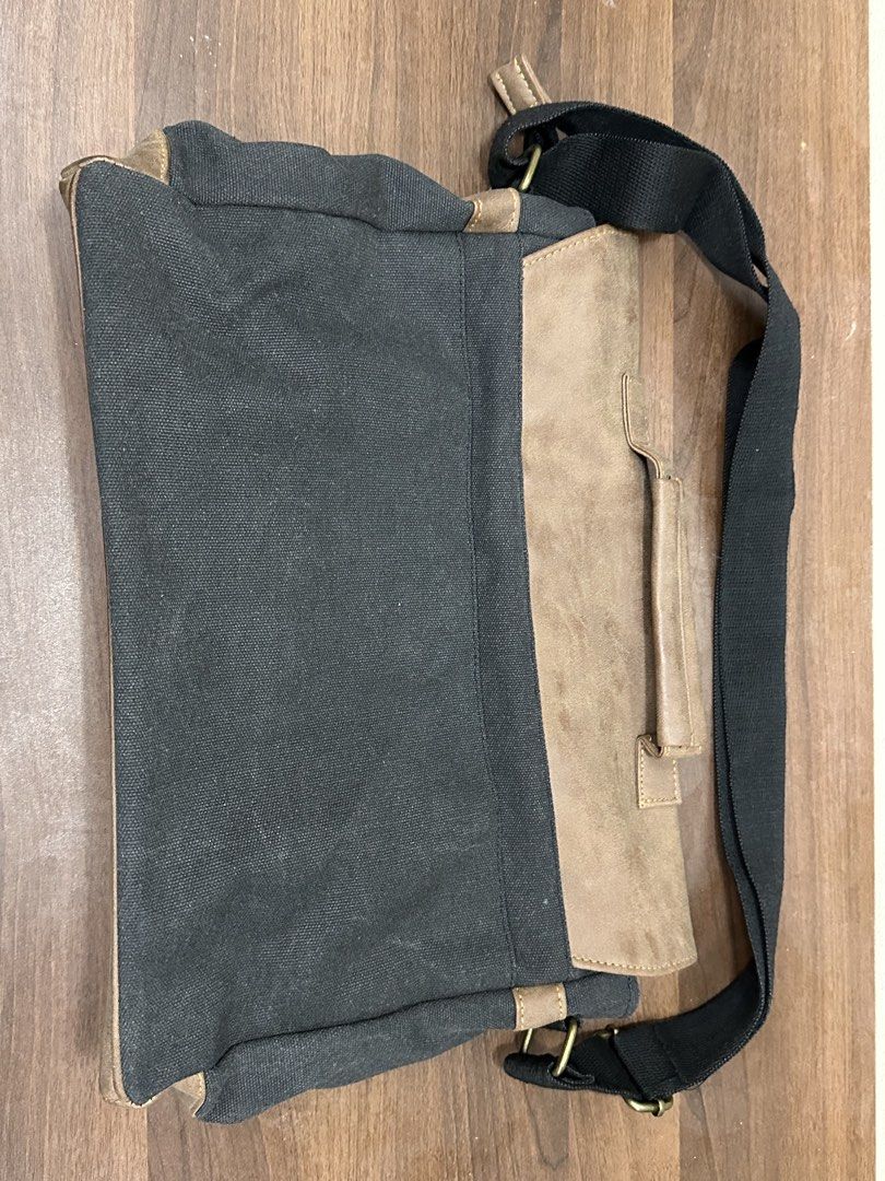 Canvas & Faux Leather Messenger Bag (Category: Sling Bags) located in Manila. Submitted by itsaladean (Listing ID 1462870322, Image 2). Description: Salvatore Mann Barely used. Good as new, the design is kinda vintage. It is not old Leather and Denim Bought it for 1,299 Selling it for 450 RFS: Decluttering - Main zippered compartment for secure storage. - Internal zip pocket for organizing smaller items. - Adjustable strap for a comfortable, cust