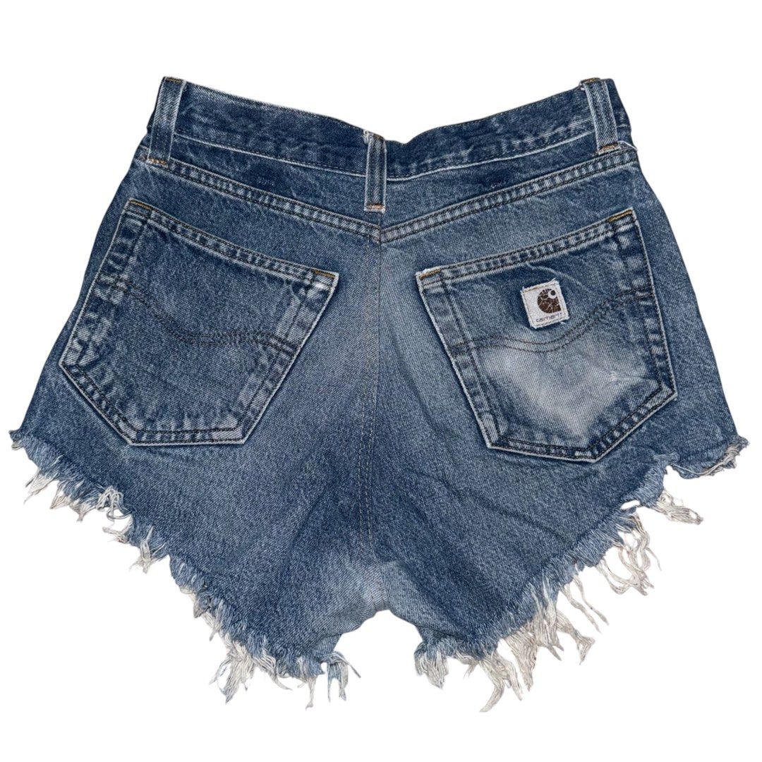 Carhartt Distressed Denim Cutoff Shorts (Category: Shorts) located in San Narciso. Submitted by angels.attic21 (Listing ID 1462704905, Image 2). Description: - Vintage Carhartt denim shorts - Size 28-30 inches waist - High-waisted style - Distressed, cutoff look - Frayed hem and ripped details - Classic Carhartt patch on back pocket - Unique piece with character - Perfect for a casual, edgy vibe.