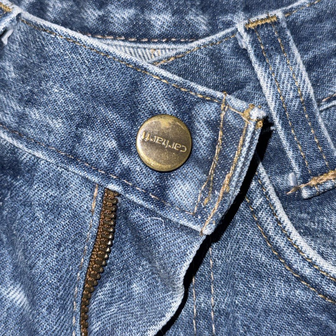 Carhartt Distressed Denim Cutoff Shorts (Category: Shorts) located in San Narciso. Submitted by angels.attic21 (Listing ID 1462704905, Image 3). Description: - Vintage Carhartt denim shorts - Size 28-30 inches waist - High-waisted style - Distressed, cutoff look - Frayed hem and ripped details - Classic Carhartt patch on back pocket - Unique piece with character - Perfect for a casual, edgy vibe.