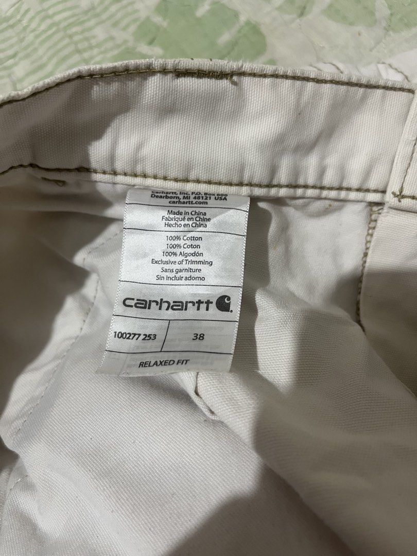 Carhartt Rugged Cargo Shorts (Category: Shorts) located in Manila. Submitted by rhaldstsh.ph (Listing ID 1462724502, Image 3). Description: Style Code: 100277Color Code: 253 (typically refers to Dark Khaki/Tan variants) Size: 38Fit: Relaxed Fit (sits comfortably through the seat and thigh) Material: 100% Cotton Canvas (heavy-duty, 8-ounce ring-spun canvas fabric) Production Date: Spring 2017 (indicated by the “Spring 17” production stamp on the i
