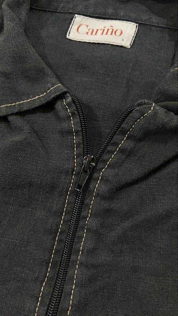 Cariño Black Zip-Up Polo (Category: Others Tops) located in Quezon City. Submitted by bitsxpieces (Listing ID 1462762063, Image 3). Description: - Black zip-up polo by Cariño - Features stylish contrast stitching along seams and collar - Lightweight material, linen - barely used!!.