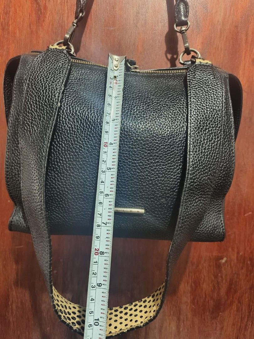 Carlyn Bag (Category: Luxury Bags & Wallets) located in San Jose del Monte. Submitted by m_nshop (Listing ID 1462773582, Image 3). Description: - Black pebbled leather handbag - Top zip closure - Top handle - Detachable shoulder strap with leopard print - Silver hardware - Small metal accent on front - Spacious interior - Ideal for everyday use payment first lalamove or jnt courier.