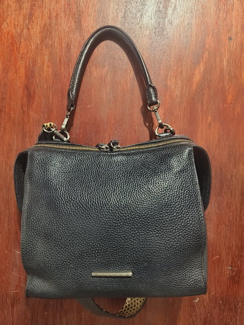 Carlyn Bag (Category: Luxury Bags & Wallets) located in San Jose del Monte. Submitted by m_nshop (Listing ID 1462773582, Image 1). Description: - Black pebbled leather handbag - Top zip closure - Top handle - Detachable shoulder strap with leopard print - Silver hardware - Small metal accent on front - Spacious interior - Ideal for everyday use payment first lalamove or jnt courier.