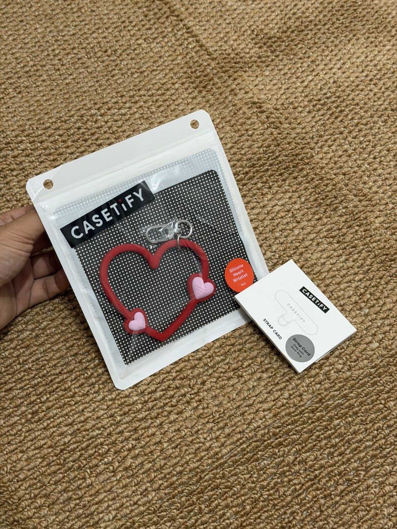 CASETiFY Silicone Heart Wristlet - Red (Category: Cases & Sleeves) located in Las Pinas. Submitted by stealsph (Listing ID 1462740931, Image 2). Description: - Brand new Casetify red silicone heart wristlet - Includes strap card - Never used, original packaging - Ideal for attaching to keys or bags - Adorable and cute design.