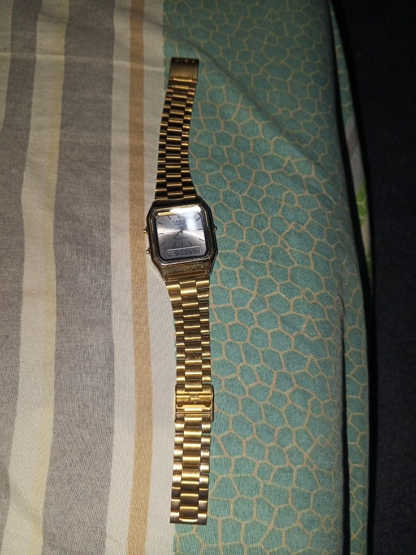 Casio AQ-230 Gold Analog Digital Watch (Category: Men's Watches) located in Magalang. Submitted by zeiansoria64090 (Listing ID 1462784897, Image 2). Description: - Classic retro gold Casio watch - declare as is - Analog and digital display - Water resistant - Stainless steel back - Made in Japan - Perfect for everyday wear - Displays time and date.