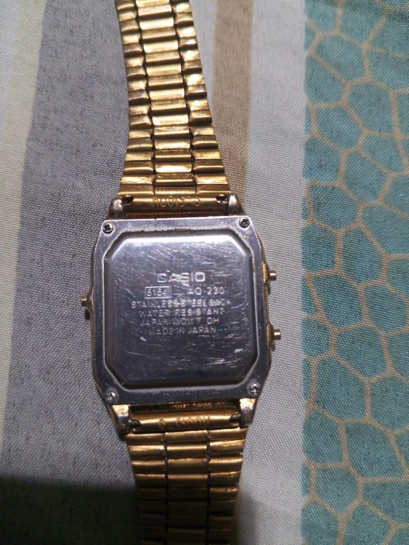 Casio AQ-230 Gold Analog Digital Watch (Category: Men's Watches) located in Magalang. Submitted by zeiansoria64090 (Listing ID 1462784897, Image 3). Description: - Classic retro gold Casio watch - declare as is - Analog and digital display - Water resistant - Stainless steel back - Made in Japan - Perfect for everyday wear - Displays time and date.
