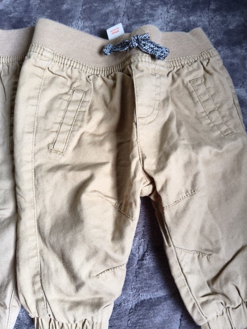 Cat & Jack Baby Pants NB/RN 0-3M (Category: Babies & Kids Fashion) located in Tarlac. Submitted by momma02 (Listing ID 1462767811, Image 2). Description: - Two pairs of tan baby pants - Brand: Cat & Jack - Style: Jogger with cuffed ankles - Features: Elastic waistband with drawstring detail - Size: NB/RN (fits 0-3 months) - Origin: Made in Vietnam - Perfect for everyday wear 100 each, 150 for 2.