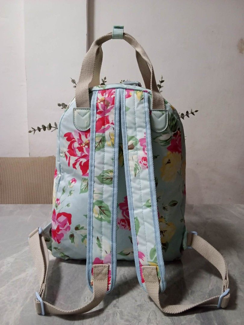 Cath Kidston Floral Backpack (Category: Backpacks) located in Manila. Submitted by cosmiccloud-9236 (Listing ID 1462748176, Image 2). Description: - Adorable floral print backpack - Light blue base with pink, yellow, and green flowers - Convenient front pocket - Adjustable straps for a comfortable fit - Secure zip closure - Ideal for everyday use or travel - Brand logo visible on front pocket.