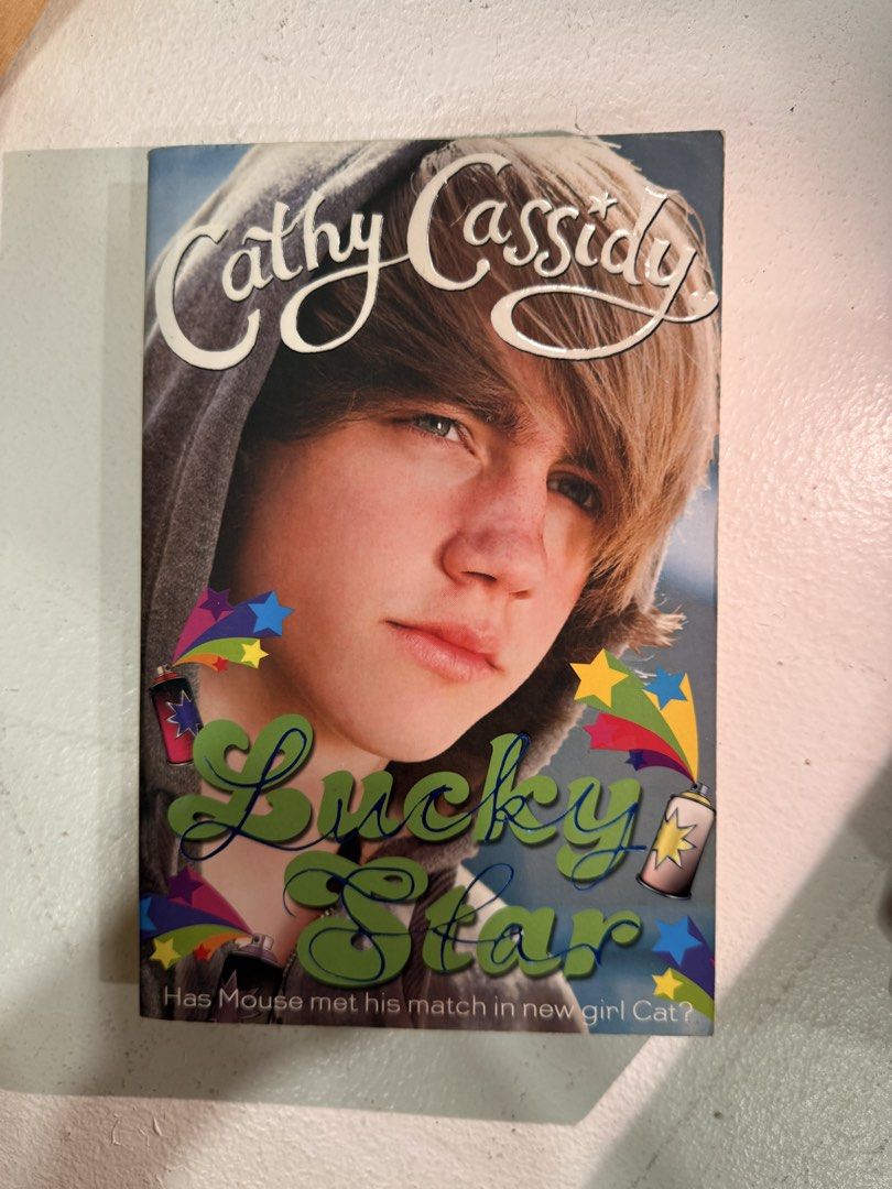 Cathy Cassidy Lucky Star Book (Category: Storybooks) located in Naga. Submitted by elaniaa (Listing ID 1462789875, Image 1). Description: - Title: Lucky Star - Author: Cathy Cassidy - Series: Best Friend Rocks! - Genre: Young Adult Fiction - Plot: Follows Cat and Mouse as they uncover each other's secrets. - Recommended for: Readers who enjoy stories about friendship and mystery..