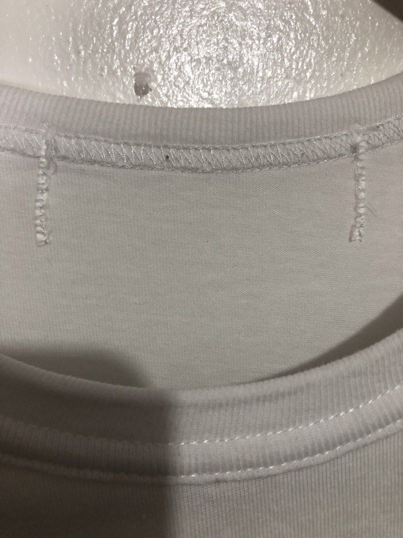 CDG Comme des Garçons White T-Shirt (Category: Luxury Apparel) located in Quezon City. Submitted by clarizedeo09960 (Listing ID 1462790209, Image 2). Description: - White Comme des Garçons (CDG) T-shirt - Features the classic CDG logo print on the front - Made from good quality cotton - Simple, stylish, and great for everyday casual wear - Please check photos for detailed condition.
