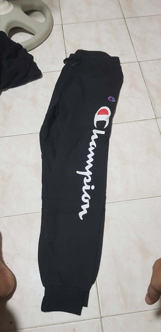 Champion Joggers Black with White Logo (Category: Joggers) located in Manila. Submitted by beachymee (Listing ID 1462693101, Image 1). Description: - Black Champion joggers - Classic white logo down the side - Elastic waistband with drawstring - Ribbed cuffs at the ankles - Comfortable and stylish for everyday wear - Great for lounging or workouts.