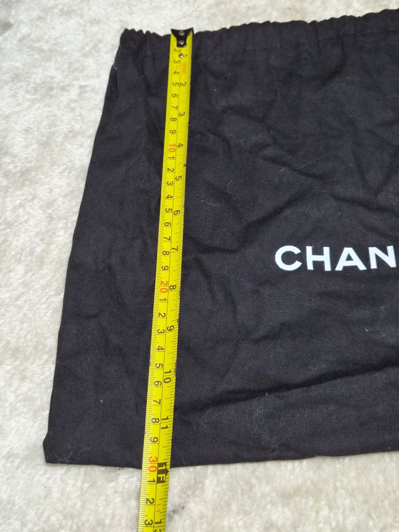 Chanel Dust Bag (Category: Baby Monitors) located in Mandaue City. Submitted by chuchi152615 (Listing ID 1462715290, Image 3). Description: - Authentic Chanel dust bag - Black fabric with white Chanel logo - Drawstring closure - Approx. dimensions: 14" height x 11" width - Ideal for storing handbags or shoes - Clean and ready for a new home.