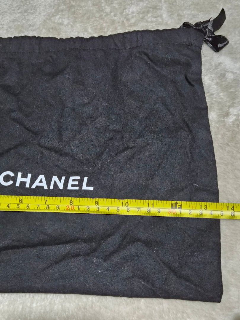 Chanel Dust Bag (Category: Baby Monitors) located in Mandaue City. Submitted by chuchi152615 (Listing ID 1462715290, Image 2). Description: - Authentic Chanel dust bag - Black fabric with white Chanel logo - Drawstring closure - Approx. dimensions: 14" height x 11" width - Ideal for storing handbags or shoes - Clean and ready for a new home.