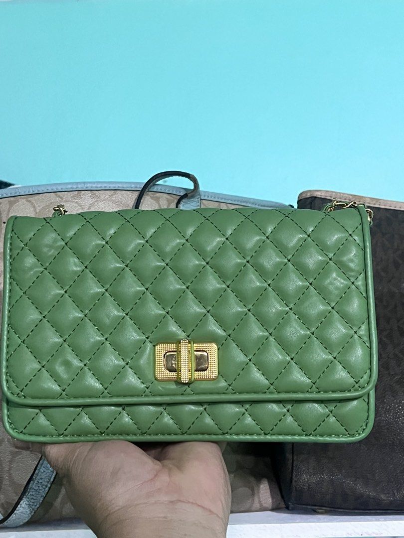 Charles & Keith Green Quilted Shoulder Bag (Category: Shoulder Bags) located in Manila. Submitted by cleverstone_21f597 (Listing ID 1462710153, Image 1). Description: - Cute green shoulder bag from Charles & Keith - Stylish quilted design - Gold hardware and clasp closure - Convenient chain strap - Interior zip pocket and card slots - Versatile for going out or everyday wear - Easily matches various outfits.