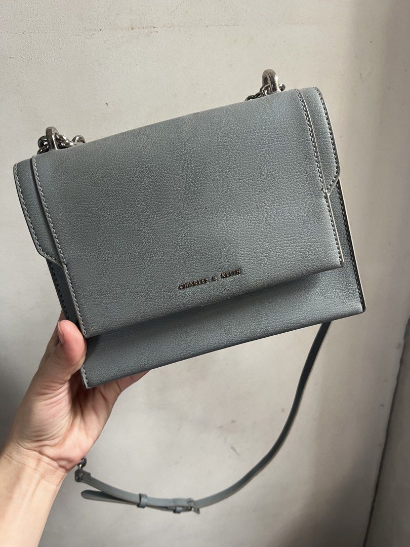 Charles & Keith Grey Chain Shoulder Bag (Category: Shoulder Bags) located in Pasig City. Submitted by x0829 (Listing ID 1462865106, Image 3). Description: - Grey shoulder bag by Charles & Keith - Features a chunky silver chain strap - Versatile: can be worn as a crossbody - Interior is clean - Minimal signs of wear - Ideal for daily use or nights out.