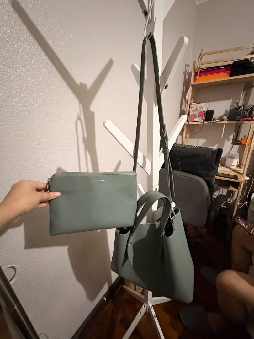 Charles & Keith Grey Handbag with Pouch (Category: Purses & Pouches) located in Mandaluyong City. Submitted by reginaldg0597 (Listing ID 1462741364, Image 2). Description: - Charles & Keith grey handbag set - Includes matching pouch - Top handles and detachable shoulder strap - Interior zippered compartment - Ideal for everyday or work use - Selling as a set - Bank transfer or GCash.