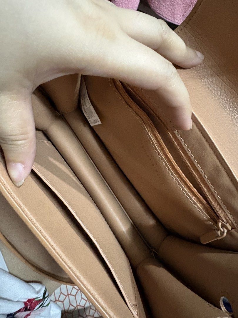 Charles & Keith Tan Shoulder Bag (Category: Shoulder Bags) located in Makati City. Submitted by cherriesforme (Listing ID 1462838815, Image 2). Description: - Brand: Charles & Keith - Color: Tan - Style: Shoulder Bag - Features: Main compartment, internal zip pocket, card slots - Strap: Adjustable - Ideal for: Everyday use.