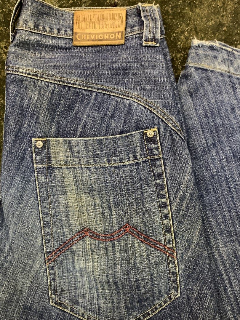 Chevignon Authentic 100% Cotton Denim Jeans (Category: Jeans) located in Manila. Submitted by thrift2mnla (Listing ID 1462812758, Image 3). Description: - Classic blue denim jeans from Chevignon - Made with 100% cotton for ultimate comfort - Unique diagonal seam detail down the legs - Distinctive red stitching on the back pocket - Relaxed fit, perfect for everyday casual wear.
