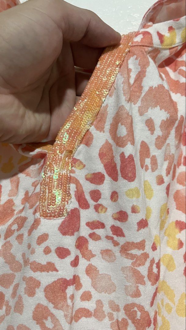 Chico's Pink Leopard Print Sequin V-Neck Top (Size 1 / US Medium (Category: Others Tops) located in Dinalupihan. Submitted by banditvaultco (Listing ID 1462845246, Image 3). Description: Brand: Chico’s Official Size: Chico’s Size 1 (Fits like a US Medium / UK 10-12) Material: Premium blend of 60% Cotton / 40% Modal for ultimate softness Condition: Excellent condition. Details: Flattering short sleeves, sequin neckline trim, relaxed fit..