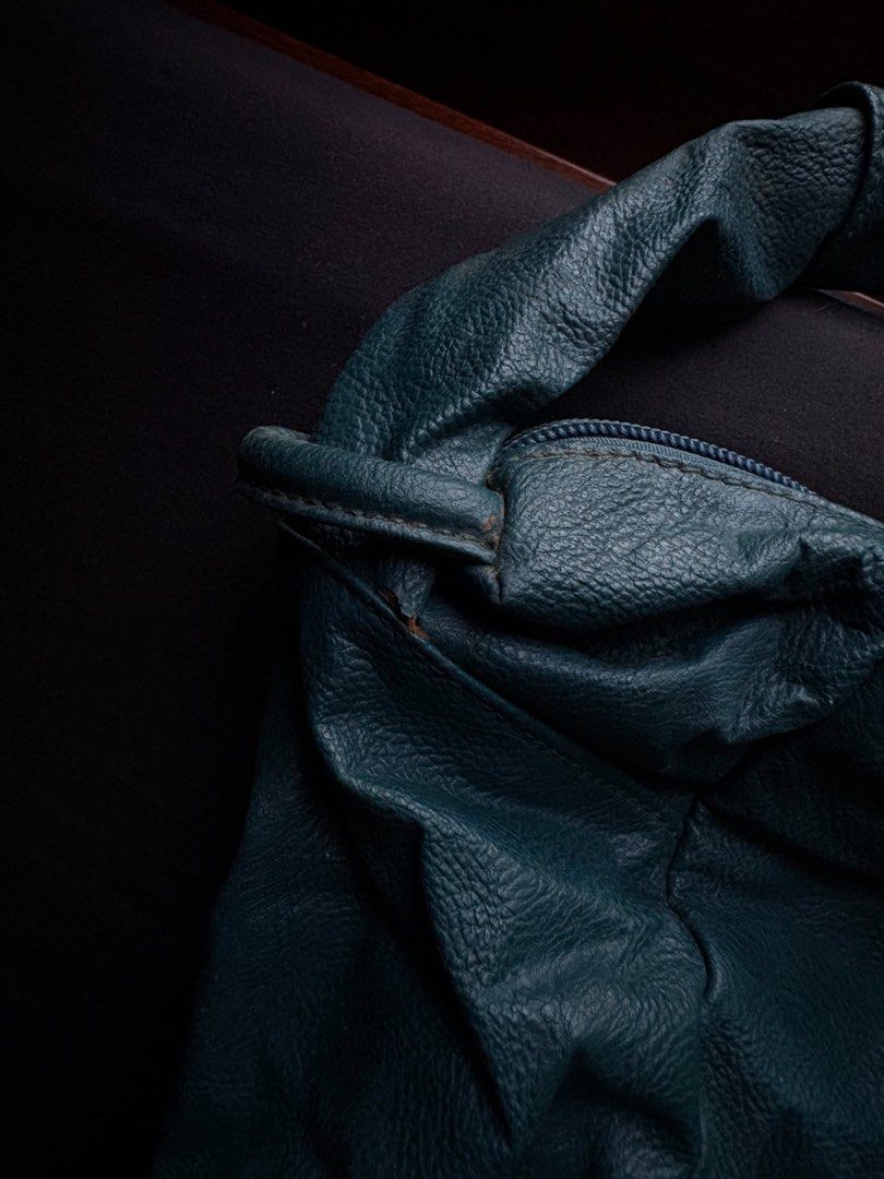Chloe Teal Leather Hobo Shoulder Bag (Category: Luxury Bags & Wallets) located in Calamba. Submitted by leeadriannn796 (Listing ID 1462707893, Image 3). Description: - Teal green leather hobo bag - Main zip compartment - Front zip pocket - Interior with patterned lining - Shows some wear on leather, particularly near strap attachments - Still a great bag for everyday use.