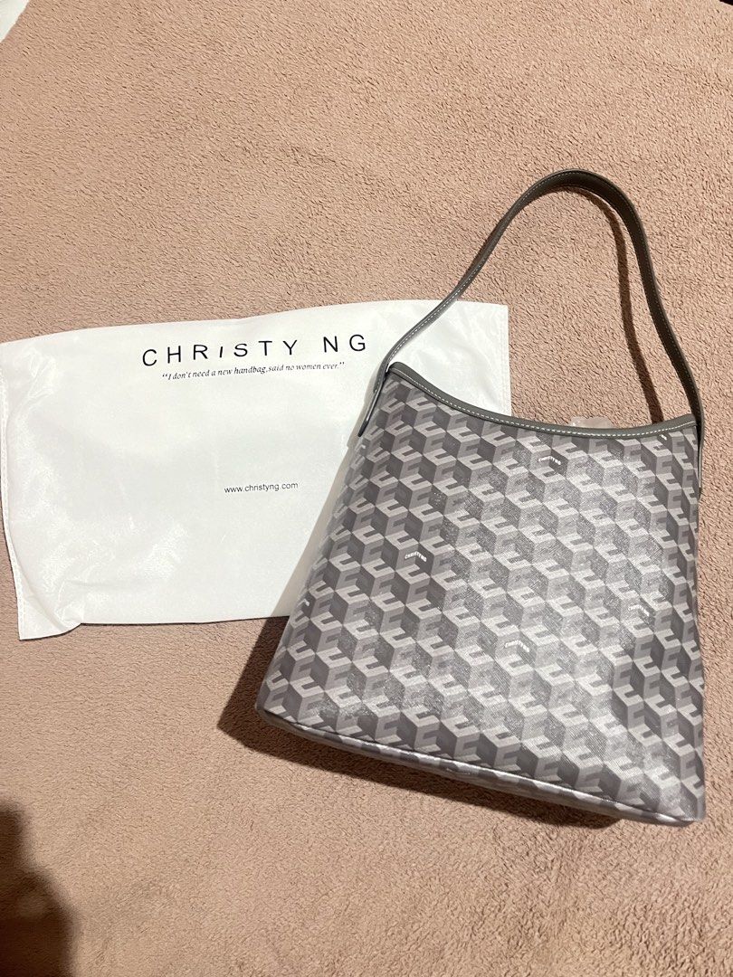 Christy Ng Alesso Medium Hobo Bag (Category: Shoulder Bags) located in Baguio. Submitted by mikachuuu368 (Listing ID 1462831775, Image 2). Description: Christy Ng Alesso Medium Hobo Bag • Color: Ash (kindaa grayy) • Never been used — comes with dust bag! • Original Price: ₱3499 • Coated canvas and other materials: Ensures durability and style. • Magnetic button closure: For secure storage. • 1 compartment & 1 zip pocket: Keep your items organized