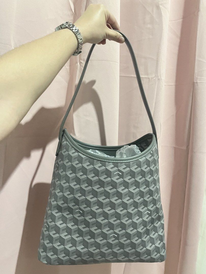 Christy Ng Alesso Medium Hobo Bag (Category: Shoulder Bags) located in Baguio. Submitted by mikachuuu368 (Listing ID 1462831775, Image 3). Description: Christy Ng Alesso Medium Hobo Bag • Color: Ash (kindaa grayy) • Never been used — comes with dust bag! • Original Price: ₱3499 • Coated canvas and other materials: Ensures durability and style. • Magnetic button closure: For secure storage. • 1 compartment & 1 zip pocket: Keep your items organized