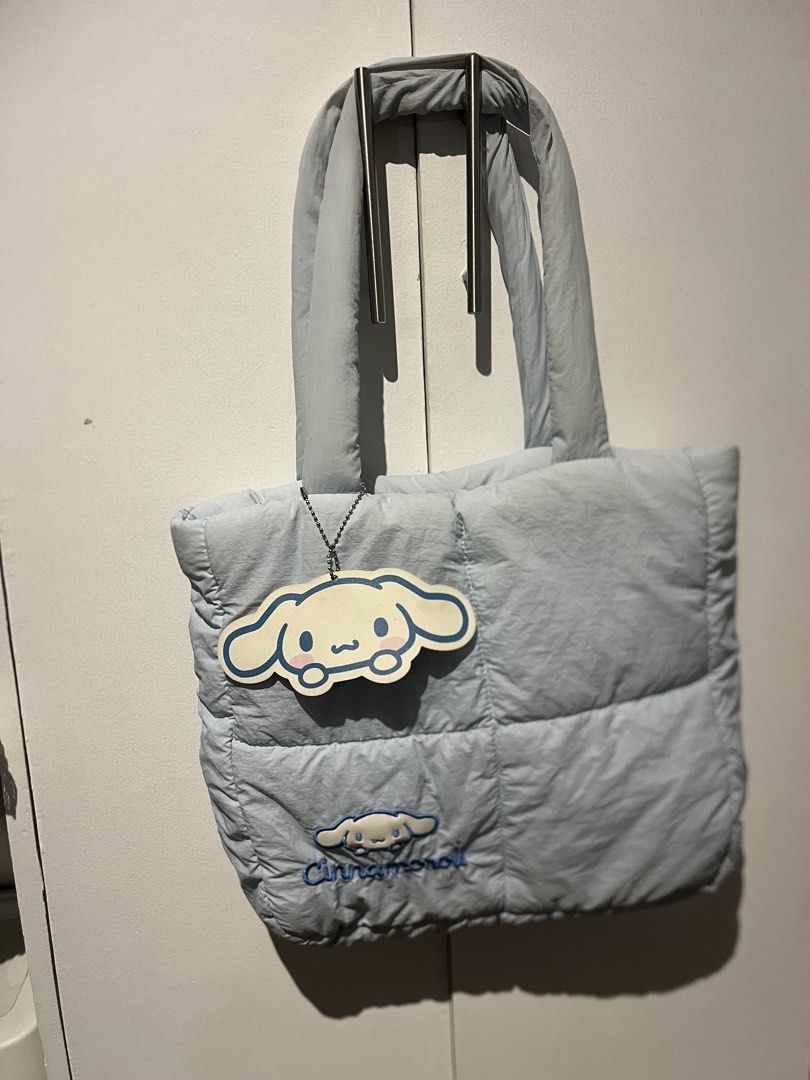 Cinnamoroll Puffer Tote (Category: Tote Bags) located in Quezon City. Submitted by _rynne (Listing ID 1462770133, Image 1). Description: PLS READ: 3 small lipstick stains on the interior of the bag, discoloration on the top of the strap but she’s well loved 🙂‍↕️ MOD: Lalamove, J&T or meetups at SM North Edsa RFS: Decluttering Loc: QC .