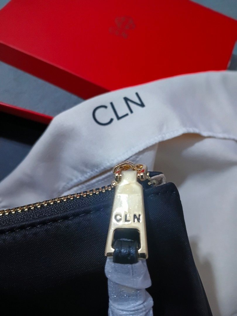 CLN CHYNA Pouch (Category: Purses & Pouches) located in Cavite. Submitted by ms.de.clutter (Listing ID 1462825436, Image 2). Description: - Black CLN pouch - Gold zipper detail - Multiple compartments and card slots inside - Comes with original red CLN box and dust bag, tag - Ideal for organizing essentials.