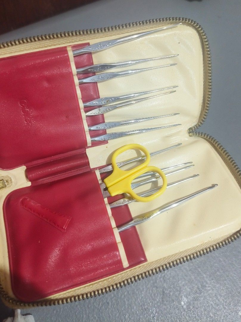 Clover Crochet Hooks Set with Case (Category: Craft Supplies & Tools) located in San Jose del Monte. Submitted by m_nshop (Listing ID 1462814873, Image 1). Description: - Vintage crochet hook set - Zippered cream-colored case with decorative embossing - Includes various sizes of metal crochet hooks - Small pair of yellow scissors included - Interior of case is red and cream - Perfect for crochet enthusiasts incomplete na po payment first jnt or l