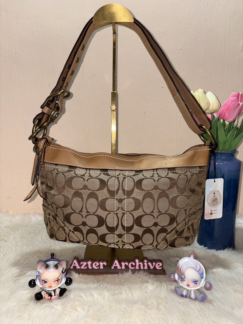 Coach 2-way Hobo bag (Category: Luxury Bags & Wallets) located in Angeles City. Submitted by azter.archive (Listing ID 1462879151, Image 1). Description: Medium size, lightly cleaned and disinfected but can look better when properly washed No rubs and runs. Watermark on leather strap. Cross-posted on my IG account..