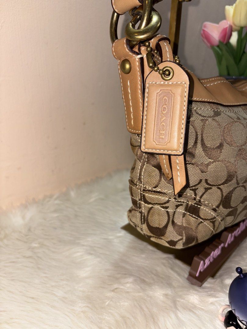 Coach 2-way Hobo bag (Category: Luxury Bags & Wallets) located in Angeles City. Submitted by azter.archive (Listing ID 1462879151, Image 3). Description: Medium size, lightly cleaned and disinfected but can look better when properly washed No rubs and runs. Watermark on leather strap. Cross-posted on my IG account..