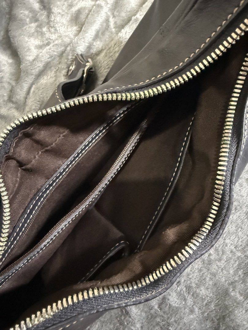 Coach Black Leather Hobo Shoulder Bag (Category: Luxury Bags & Wallets) located in Cainta. Submitted by amswardrobe (Listing ID 1462851460, Image 3). Description: - Classic black leather Coach hobo bag - Silver buckle detail on the front - Main zip compartment with interior pockets - Comfortable shoulder strap for everyday use - Versatile and practical.