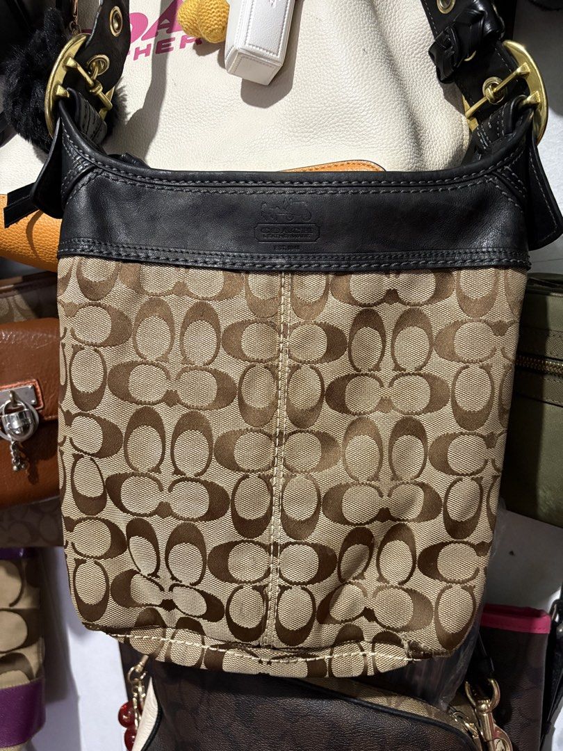 Coach Bleecker Monogram Canvas (Category: Luxury Bags & Wallets) located in Makati City. Submitted by cherriesforme (Listing ID 1462741512, Image 2). Description: - Classic Coach bag - Signature monogram canvas with black leather trim - Gold hardware details - Zipper closure - Interior zip pocket and slip pockets - Great everyday bag Kindly see last photo for stains inside.