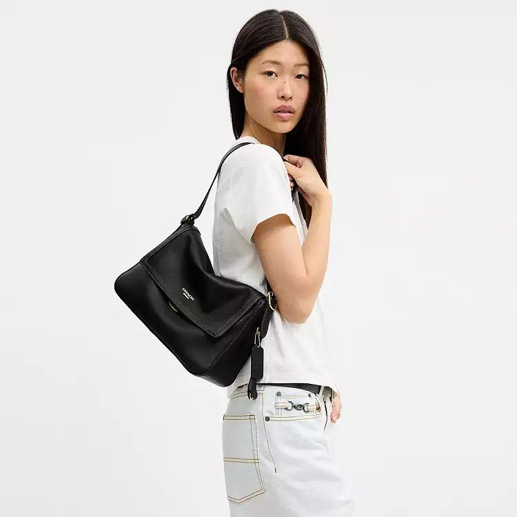 Coach Etta Flap Bag in Black 💖 (Category: Shoulder Bags) located in Manila. Submitted by the.real.love.elle (Listing ID 1462682327, Image 1). Description: ✈️ 2-6 weeks ETA 🚢 2-3 months ETA 🛒 Pre order 💌 DM for inquiries and orders Love, Elle is not affiliated with the brands mentioned. All rights and trademarks are the property of their respective owners. No sponsorship, endorsement, or property infringement is intended; all brand names and l