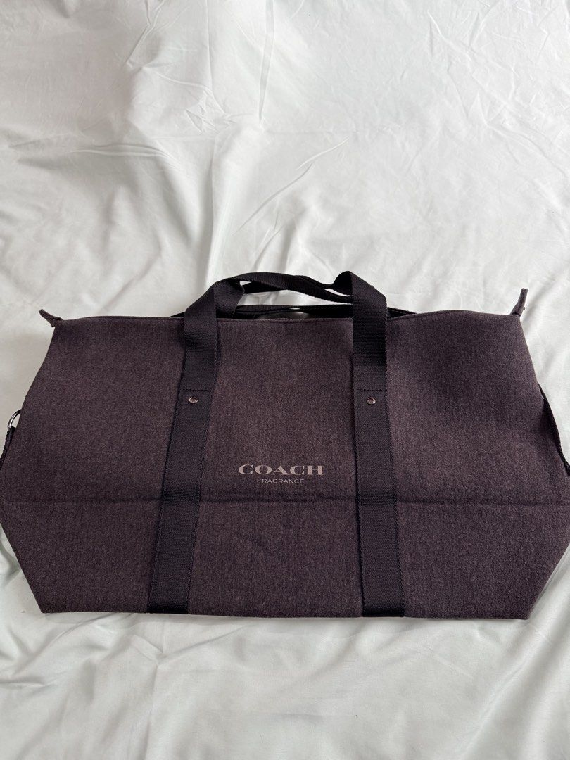 Coach Fragrance Duffel Bag (Category: Sling Bags) located in Manila. Submitted by purplebunnie1 (Listing ID 1462767438, Image 3). Description: - Coach dark grey duffel bag - Zippered main compartment - Two top handles - Zipper pull features Coach logo - Ideal for travel or gym use -Felt Texture.