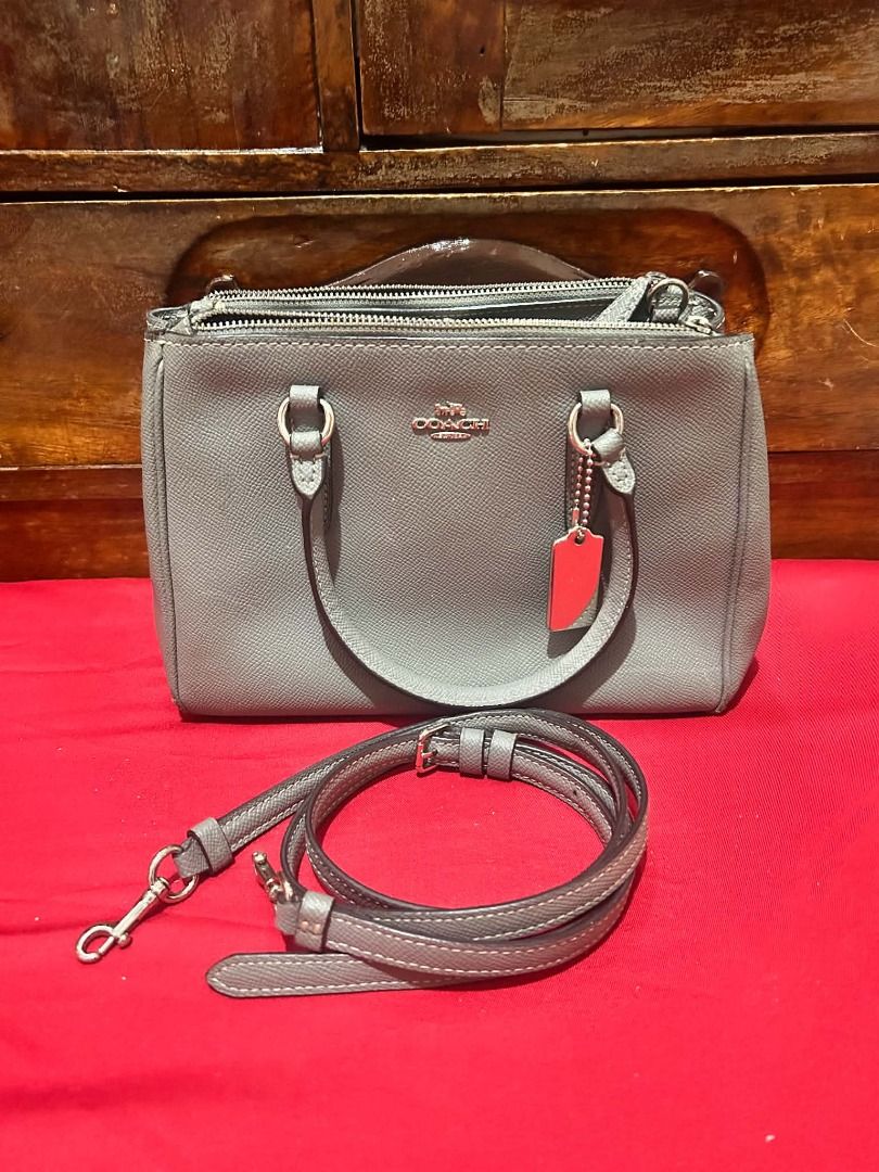 Coach Grey Leather Satchel Handbag (Category: Luxury Bags & Wallets) located in Valenzuela. Submitted by sv072724 (Listing ID 1462741543, Image 1). Description: - Coach grey leather satchel bag - Main zip compartment - Inner zip pocket - Detachable strap - Perfect size for everyday use - Interior leather tag shows some wear Flaws seen on the picture .