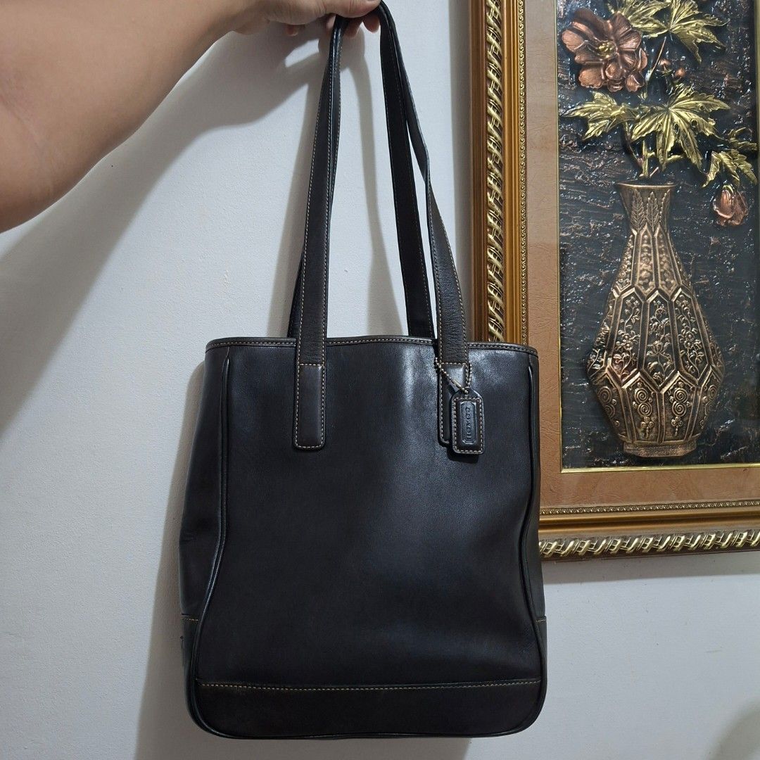 Coach Hampton 7776 Black Leather Tote Bag (Category: Luxury Bags & Wallets) located in Santa Rosa. Submitted by rponlineshop (Listing ID 1462880012, Image 1). Description: - Classic black Coach leather tote bag. - Spacious interior with secure zip closure. - Comfortable shoulder straps for easy carrying. - Durable, high-quality leather with a great feel. - Perfect for everyday use or professional settings. - Authentic with serial number visible i