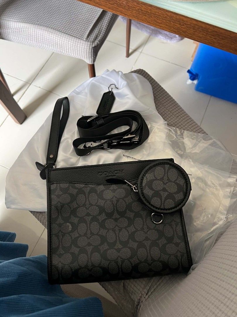 Coach Hitch Convertible Crossbody Bag (Category: Sling Bags) located in Manila. Submitted by incywincy_ (Listing ID 1462701113, Image 1). Description: -used mainly as clutch bag only -includes: sling strap at coin purse brand new -hindi nagamit as hand bag only lang nagagamit) check more pics pm for assurance - Coach crossbody bag in signature monogram print - Color: Black and grey - Includes detachable wrist strap - Separate zippered coin pouch 