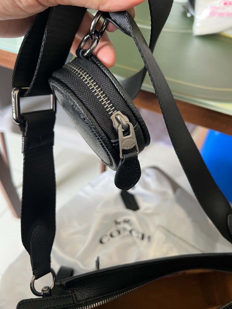 Coach Hitch Convertible Crossbody Bag (Category: Sling Bags) located in Manila. Submitted by incywincy_ (Listing ID 1462701113, Image 3). Description: -used mainly as clutch bag only -includes: sling strap at coin purse brand new -hindi nagamit as hand bag only lang nagagamit) check more pics pm for assurance - Coach crossbody bag in signature monogram print - Color: Black and grey - Includes detachable wrist strap - Separate zippered coin pouch 